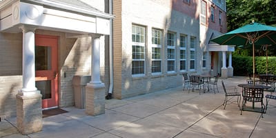 Outdoor seating area with tables and umbrellas