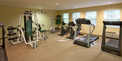 An interior view of a fitness room with equipment