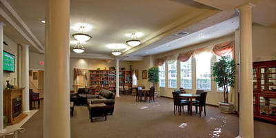 Bright common area with seating and bookshelves