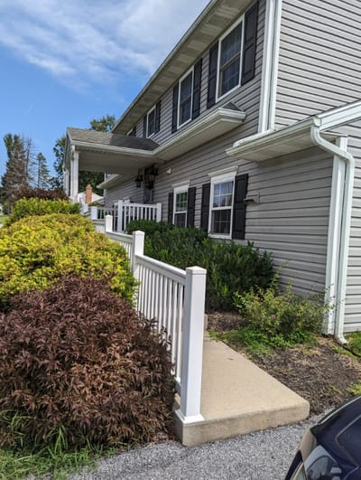 Exterior view of Magnolia Manor with landscaping in front