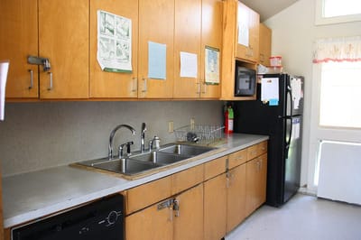 Interior kitchen area with wooden cabinets and appliances