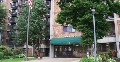 Exterior view of Linden Towers building with greenery