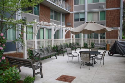Outdoor seating area with benches and a table