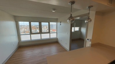Bright interior view of a residential unit with large windows