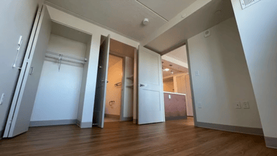 View of a resident room with closets and flooring