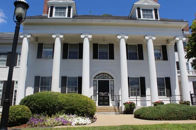 Exterior view of a senior living facility with columns