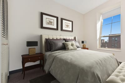 Bright, well-furnished resident bedroom with window view