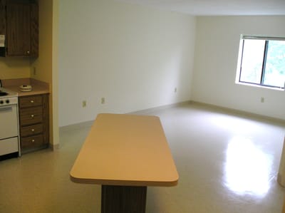 Empty room with a table and a window
