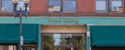 Exterior view of Fabens Building with signage