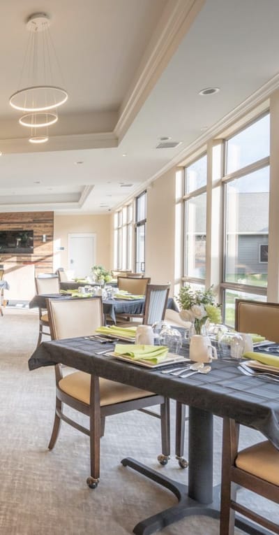 Modern dining room with tables set for a meal