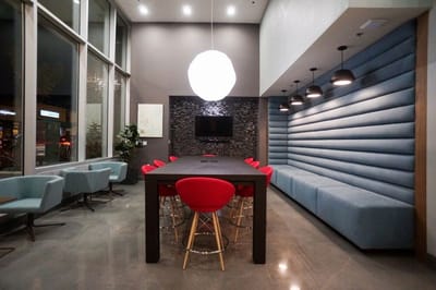 Modern common area with seating and dining table