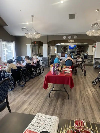 Residents playing bingo in a communal activity room