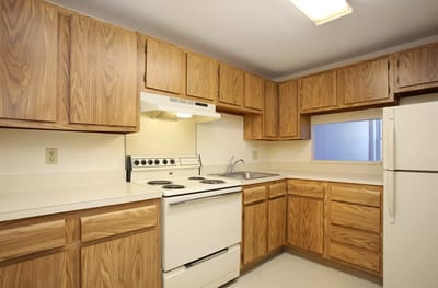 Bright and clean kitchen area with wood cabinetry