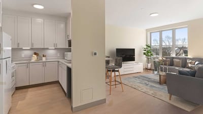 Bright, modern living space with a kitchen and seating area