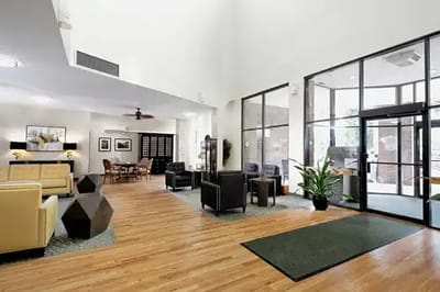 Bright lobby area with seating and plants