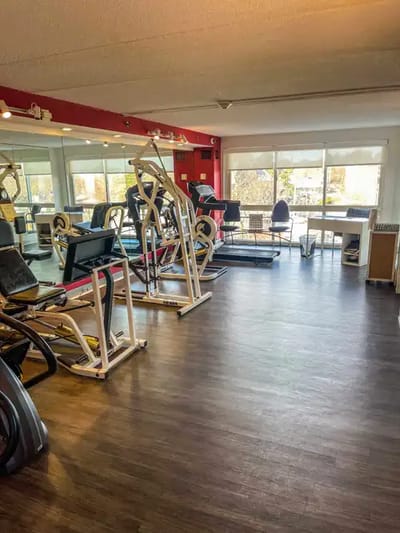 Interior view of a fitness area with exercise equipment