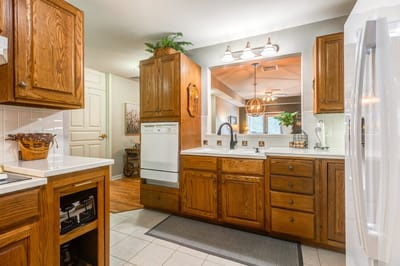 Bright kitchen interior with wooden cabinets and countertop
