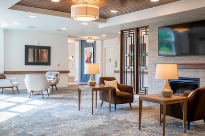 Bright common area with seating and light decor