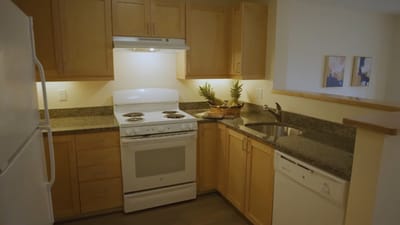 A well-lit kitchen area with modern appliances