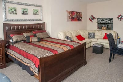 Cozy interior of a resident room with a bed and sofa