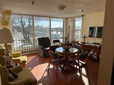 Bright common area with seating and a view outside