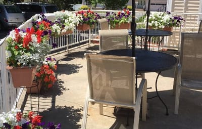 Outdoor patio with flower pots and seating