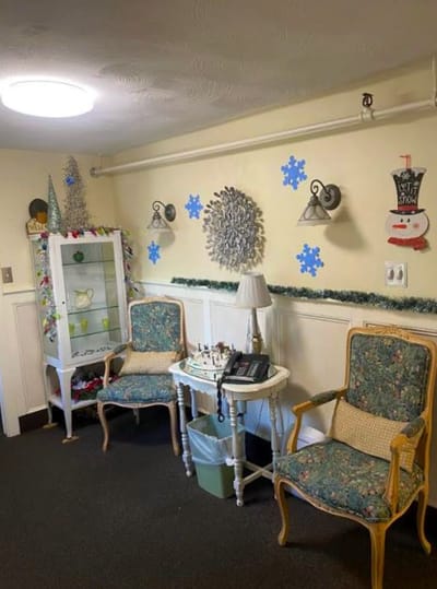 Cozy common area with seasonal decorations and chairs