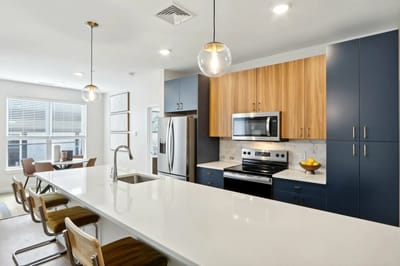 Modern kitchen interior with seating and appliances