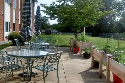 Outdoor seating area with garden and patio furniture