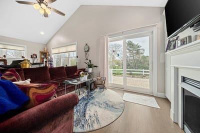 Interior view of a cozy common area with large windows