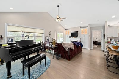 Bright, airy interior space with a piano