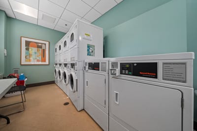 Laundry room with commercial washers and dryers