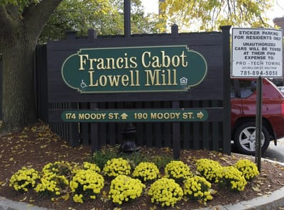 Signage for Francis Cabot Lowell Mill with flowers