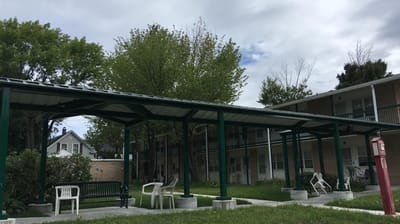 Outdoor covered seating area at a senior facility