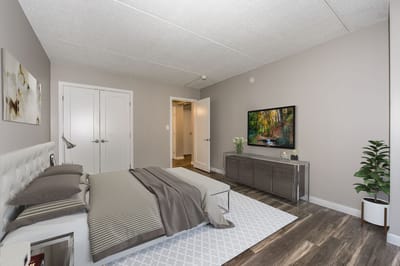 A well-furnished bedroom in a senior living facility