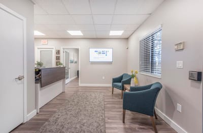 Interior view of a facility lobby with seating area