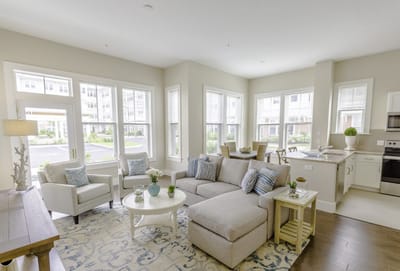 Bright common area with comfortable seating and large windows