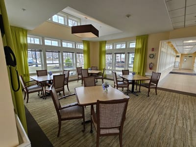 Bright dining area with tables and chairs