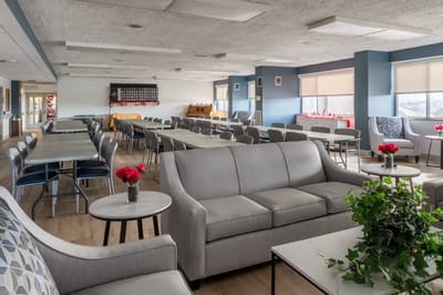 Bright common area with seating and tables
