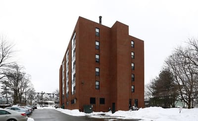 Exterior view of a brick building in winter