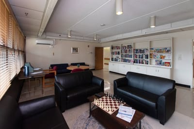 Common area featuring seating and a chessboard