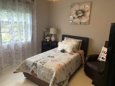 Cozy private room with simple decor and natural light