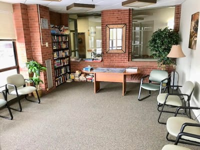 Common area with seating and bookshelves