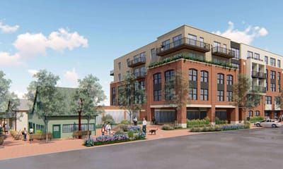 Exterior view of Solera Senior Living building with outdoor seating