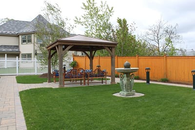 Outdoor seating area with gazebo and fountain