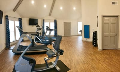 Interior view of a fitness area with exercise equipment