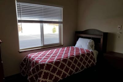 A single resident room with a bed and window
