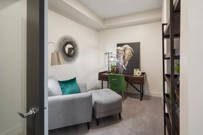 A cozy interior room with a desk and chair