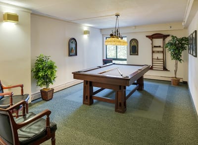 Interior view of a billiards room with seating