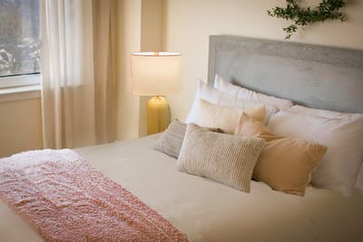Well-decorated bedroom with soft lighting